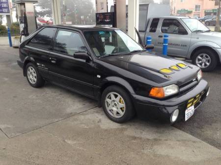 1988 Mazda 323 GTX black right front