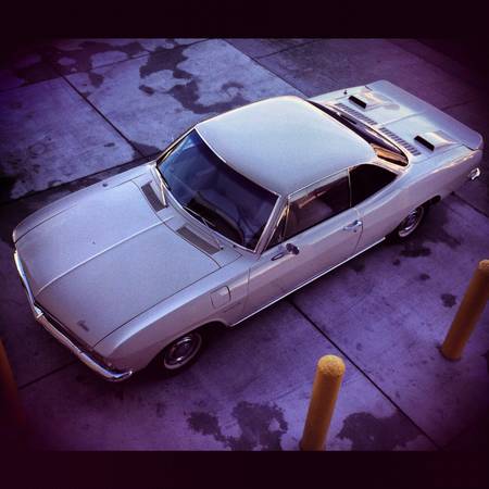1965 Chevrolet Corvair 500 coupe above